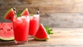 Delicious fresh watermelon drink on wooden table. Space for text Royalty Free Stock Photo