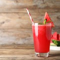 Delicious fresh watermelon drink on wooden table. Space for text Royalty Free Stock Photo