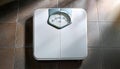 A white analog bathroom scale Royalty Free Stock Photo