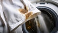 A stained white shirt hangs in front of a washing machine Royalty Free Stock Photo