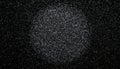 Black Glitter Texture Background with Faint Circular Spotlight in Center Royalty Free Stock Photo