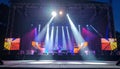 Empty festival stage with bright spotlights and colorful backdrops Royalty Free Stock Photo
