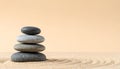 Stacked Smooth River Stones in Zen Balance on Matte Light Sand Background Royalty Free Stock Photo