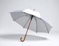 Open umbrella blown by wind gust on white background Royalty Free Stock Photo