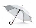 Open umbrella blown by wind gust on white background Royalty Free Stock Photo