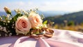 The wedding rings are tied with ribbons and beautiful flowers on pink fabric Royalty Free Stock Photo