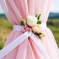 The wedding rings are tied with ribbons and beautiful flowers on pink fabric Royalty Free Stock Photo