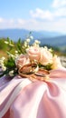The wedding rings are tied with ribbons and beautiful flowers on pink fabric Royalty Free Stock Photo