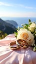 The wedding rings are tied with ribbons and beautiful flowers on pink fabric Royalty Free Stock Photo