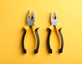Combination pliers on color background, top view Royalty Free Stock Photo