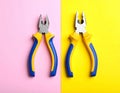 Combination pliers on color background, top view Royalty Free Stock Photo