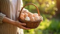Woman with a basket of raw eggs with blurred background, closed Royalty Free Stock Photo