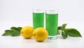 Fresh juicy lemons and a green drink on a white background. Royalty Free Stock Photo