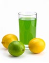 Fresh juicy lemons and a green drink on a white background. Royalty Free Stock Photo