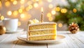 Close-up of birthday cake slice with lit candle and soft bokeh lights Royalty Free Stock Photo