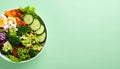 Bowl of mixed fresh vegetables on matte pastel green gradient background, symbolizing healthy nutrition Royalty Free Stock Photo
