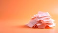 Neatly arranged pile of receipts on matte pastel orange gradient background Royalty Free Stock Photo
