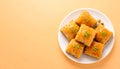Baklava pieces on matte warm beige gradient background Royalty Free Stock Photo