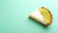 Key lime pie slice on matte pastel teal gradient background Royalty Free Stock Photo