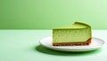 Slice of matcha cheesecake on simple plate with mint green gradient background Royalty Free Stock Photo