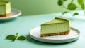 Slice of matcha cheesecake on simple plate with mint green gradient background Royalty Free Stock Photo