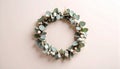 Small dried eucalyptus wreath on matte soft cream gradient background Royalty Free Stock Photo