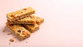 Stacked granola bars on matte pastel peach gradient background Royalty Free Stock Photo