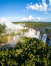 Giant waterfall with misty clouds over expansive valley Royalty Free Stock Photo