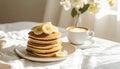 Three-quarter view of pancakes with banana slices and cappuccino Royalty Free Stock Photo