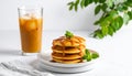 Three-quarter pancakes with caramel drizzle and iced green tea Royalty Free Stock Photo