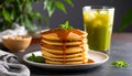 Three-quarter pancakes with caramel drizzle and iced green tea Royalty Free Stock Photo