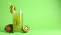 Glass of refreshing drink and cut kiwi on green background, space for text Royalty Free Stock Photo
