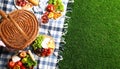 Flat lay composition with picnic basket and products on checkered blanket outdoor Royalty Free Stock Photo