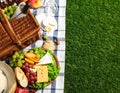 Flat lay composition with picnic basket and products on checkered blanket outdoor Royalty Free Stock Photo