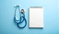 Stethoscope and Small Notebook on Light Blue to White Gradient Royalty Free Stock Photo