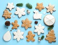 Different delicious Christmas cookies on light blue background, flat lay Royalty Free Stock Photo