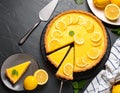 Delicious lemon pie, lemon cake and cake server on black textured table Royalty Free Stock Photo