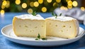 Two slices of havarti with visible texture on white ceramic plate soft bokeh background Royalty Free Stock Photo