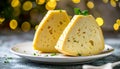 Two slices of havarti with visible texture on white ceramic plate soft bokeh background Royalty Free Stock Photo