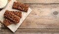 Delicious chocolate puffed rice bars on wooden table, flat lay. Space for text Royalty Free Stock Photo