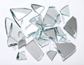 Shards of broken mirror on white background, top view Royalty Free Stock Photo