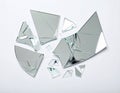 Shards of broken mirror on white background, top view Royalty Free Stock Photo
