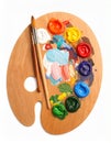 Wooden artist\'s palette with mixed paints and brush isolated on white Royalty Free Stock Photo