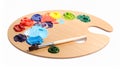 Wooden artist\'s palette with mixed paints and brush isolated on white Royalty Free Stock Photo