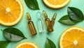 Skincare ampoules with vitamin C, slices of orange and leaves on light green bnd Royalty Free Stock Photo