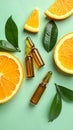 Skincare ampoules with vitamin C, slices of orange and leaves on light green bnd Royalty Free Stock Photo