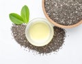 Composition with jar of chia oil and seeds on white background, top view Royalty Free Stock Photo