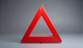 Bold red warning triangle icon on matte gray background centered Royalty Free Stock Photo