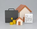 Real Estate Investment Concept with Houses, Coins, and Briefcase Royalty Free Stock Photo