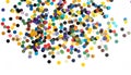 generated using AI.A scattering of multicolored confetti dots on a white background. Royalty Free Stock Photo